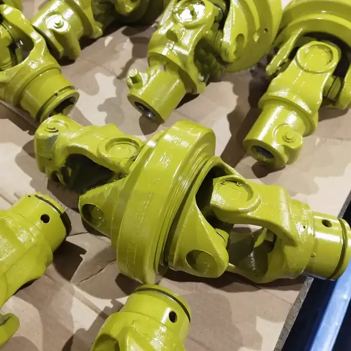 Wide angle universal joint for PTO shaft showing the internal cross structure and bearing cup assembly