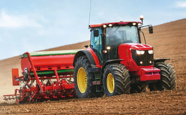 Tractor hydraulic lift cylinder application showing the connection between PTO driveline and hydraulic positioning system
